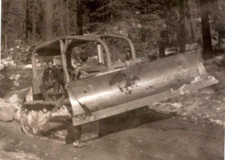 The style of logging in Plumas County and Lassen County was known as
"Cat logging", as opposed to "high-lead logging" with a tall tower to
obtain lift that is more common on the coast in Oregon, Washington and
Alaska. Here, Cat skinner Maurice Olson of (Portola) Keddie poses with
the Cat D-7 with a hydraulic dozer that my father named Tweety Bird.
Swain Mountain c.
1965.